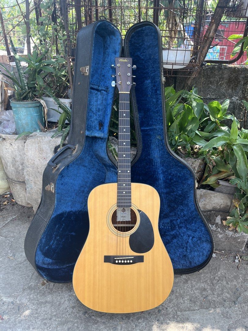 Hotaka HM201 Acoustic Guitar with Case (Category: Musical Instruments) located in Manila. Submitted by nathanmagtibay (Listing ID 1433890763, Image 1). Description: - Hotaka HM201 Acoustic Guitar - Natural wood finish on the front - Darker wood finish on the back - Hotaka logo on the headstock - Includes a blue-lined hard case - Made by Morris since 1965.