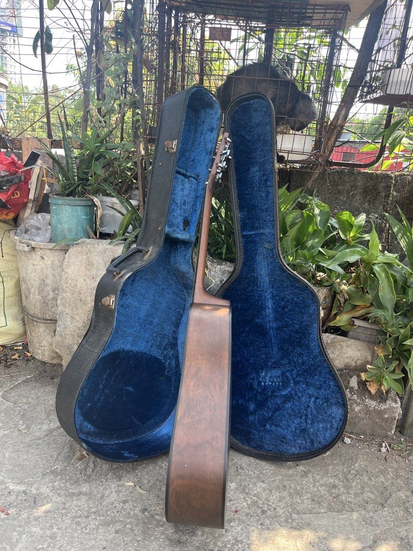 Hotaka HM201 Acoustic Guitar with Case (Category: Musical Instruments) located in Manila. Submitted by nathanmagtibay (Listing ID 1433890763, Image 3). Description: - Hotaka HM201 Acoustic Guitar - Natural wood finish on the front - Darker wood finish on the back - Hotaka logo on the headstock - Includes a blue-lined hard case - Made by Morris since 1965.