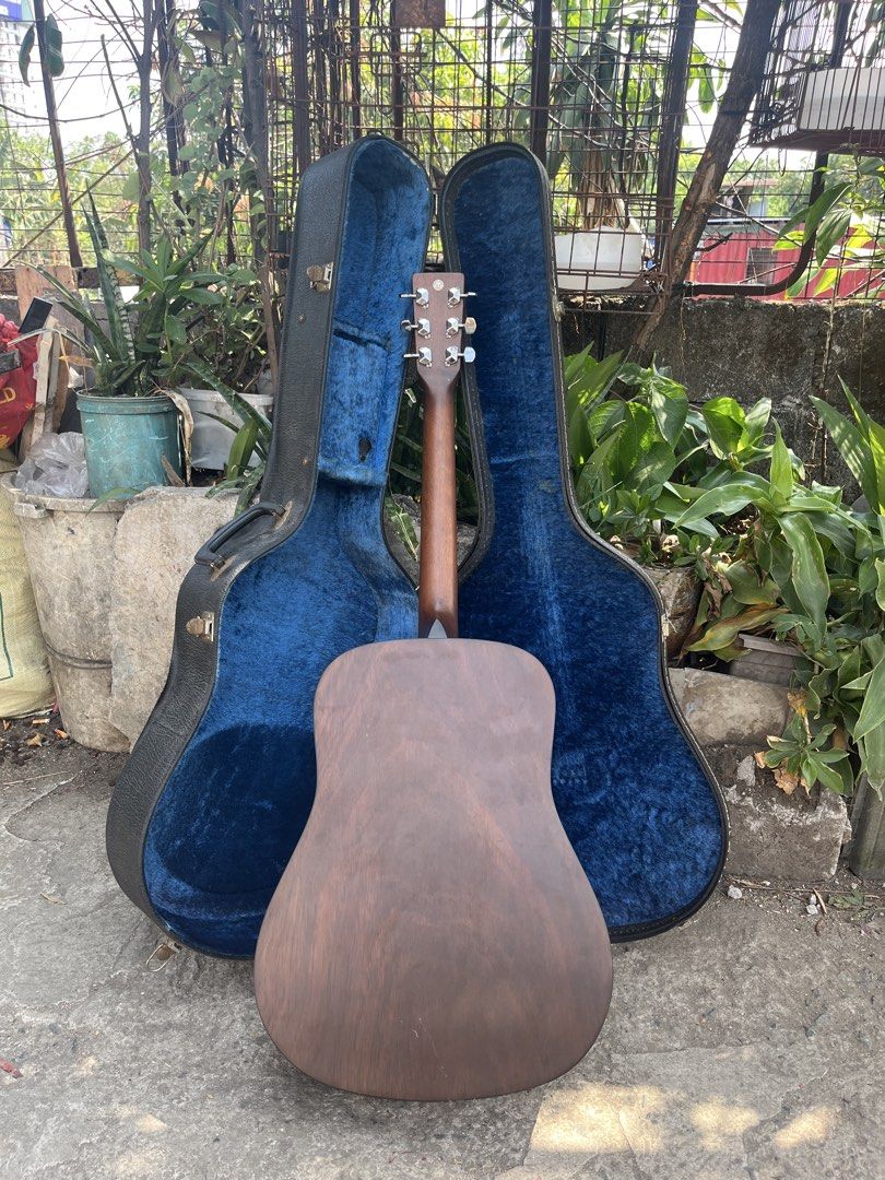 Hotaka HM201 Acoustic Guitar with Case (Category: Musical Instruments) located in Manila. Submitted by nathanmagtibay (Listing ID 1433890763, Image 2). Description: - Hotaka HM201 Acoustic Guitar - Natural wood finish on the front - Darker wood finish on the back - Hotaka logo on the headstock - Includes a blue-lined hard case - Made by Morris since 1965.