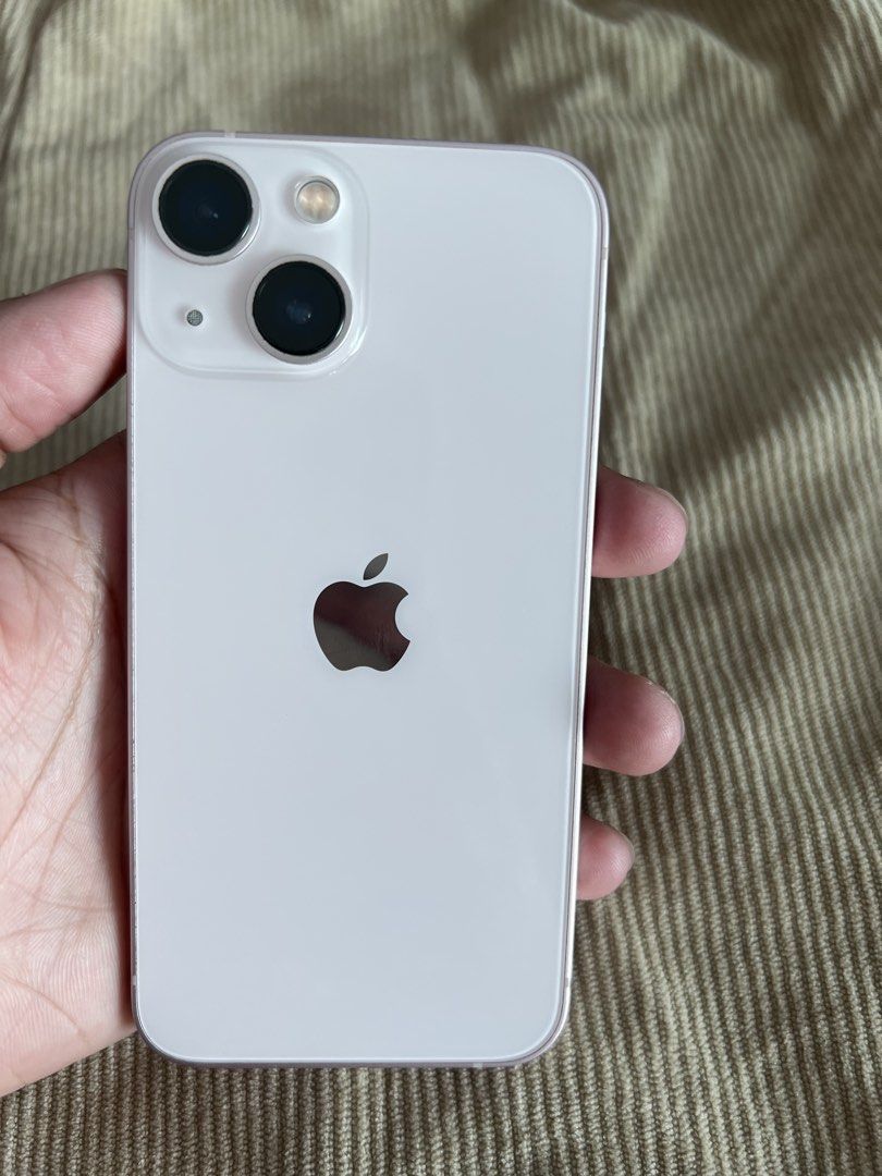 Iphone 13 mini 128gb (FOR SALE) (Category: iPhone 13 Series) located in Manila. Submitted by chardie00073451 (Listing ID 1433789263, Image 2). Description: Iphone 13 mini (pink) 128gb (original no history of repair) ✅all features are working smoothly ✅makinis with minimal dents lang ✅good as new ✅no history of repair ✅sobrang linaw ng camera at .5 Freebies -Lighting cable with adaptor -Magnetic case charger -used phone case ISSUE - Battery health