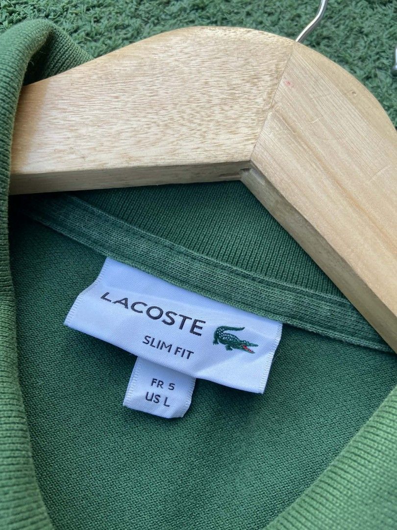Lacoste Slim Fit Polo Shirt (Category: Tshirts & Polo Shirts ) located in Manila. Submitted by jaybenethrift.0721 (Listing ID 1433872196, Image 2). Description: - Lacoste polo shirt AUTHENTIC - Size: L - Fit: Slim Fit - Color: Green - Features the iconic Lacoste logo - Classic polo collar and button-up placket.