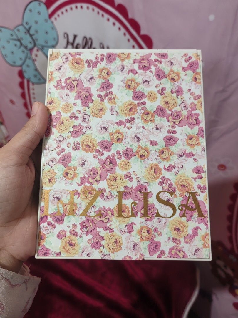LIZ LISa Mirror (Category: Mirrors) located in Manila. Submitted by zaekim1380 (Listing ID 1433784142, Image 1). Description: - Floral design cover - Rectangular shape - White frame - Compact and portable - Features "IN LISA" print - Ideal for daily use.