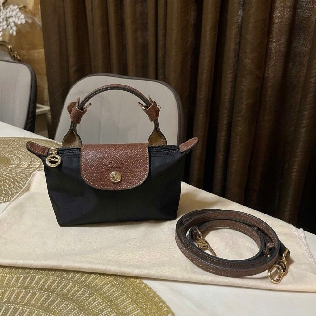 Longchamp le pliage mini sling coach crossbody bag (Category: Cross-body Bags) located in Subic. Submitted by poochieooo (Listing ID 1433864355, Image 1). Description: Preloved but in good condition Used twice Top tier quality from HK NGA!!! Price is such a steal!! Pls manage your expectations this is preloved/used (For sure buyers only) 🫶🏻.