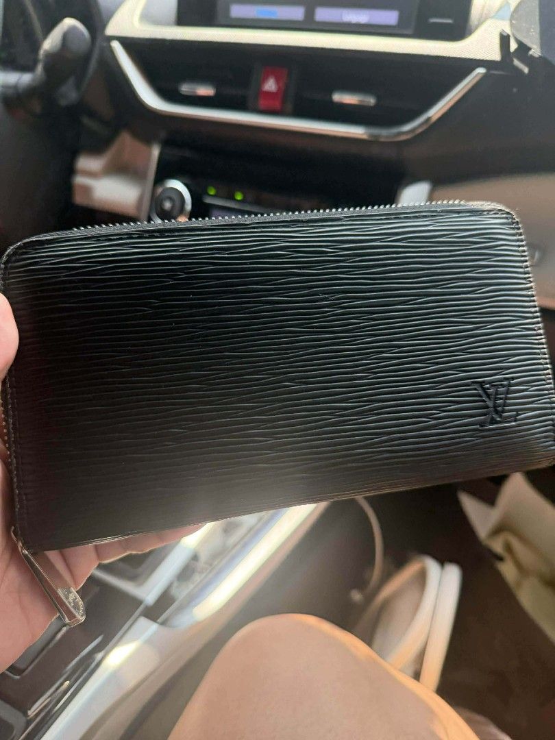 Louis Vuitton Epi Zippy Wallet (Category: Luxury Bags & Wallets) located in Davao. Submitted by jenpolinar (Listing ID 1433927755, Image 2). Description: - Authentic Louis Vuitton Zippy wallet - Black Epi leather - Zip-around closure - Iconic LV logo - Stylish and classic design - Perfect for everyday use.
