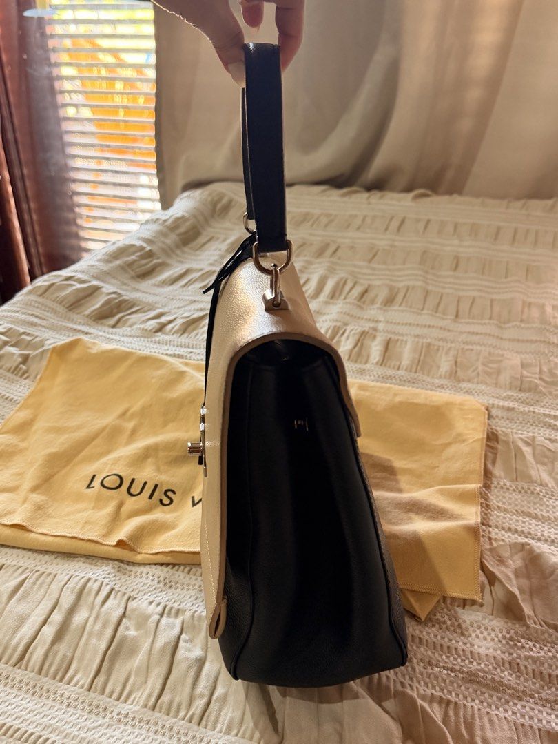 LOUIS VUITTON LOCK ME II (Category: Luxury Bags & Wallets) located in Taytay. Submitted by madamepean (Listing ID 1433910583, Image 3). Description: Original LV Lock me II With straps, cards, entrupy Dustbag RUSH SALE 50,000 only! Free LBC shipping.