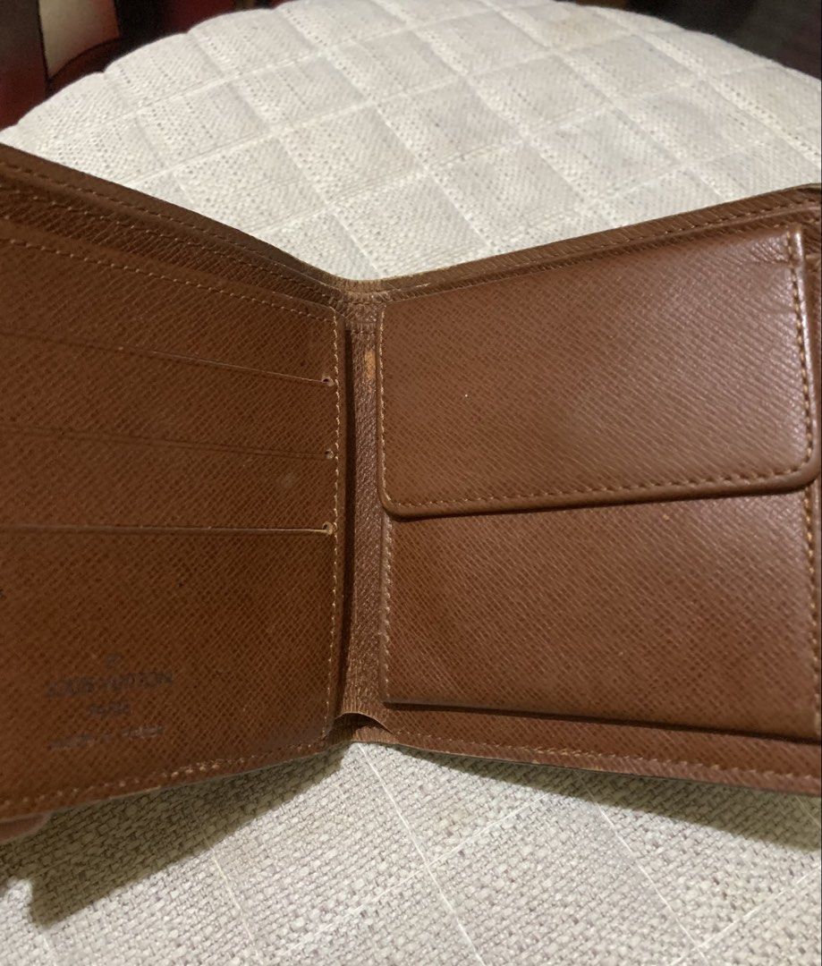 Louis Vuitton Monogram Wallet (Category: Luxury Bags & Wallets) located in Quezon City. Submitted by ncjnc (Listing ID 1433797890, Image 2). Description: - Authentic Louis Vuitton wallet - Classic Monogram pattern - Multiple card slots - Bill compartment - Light brown leather interior - Coin pocket with snap closure - Embossed "Louis Vuitton Paris Made in France".
