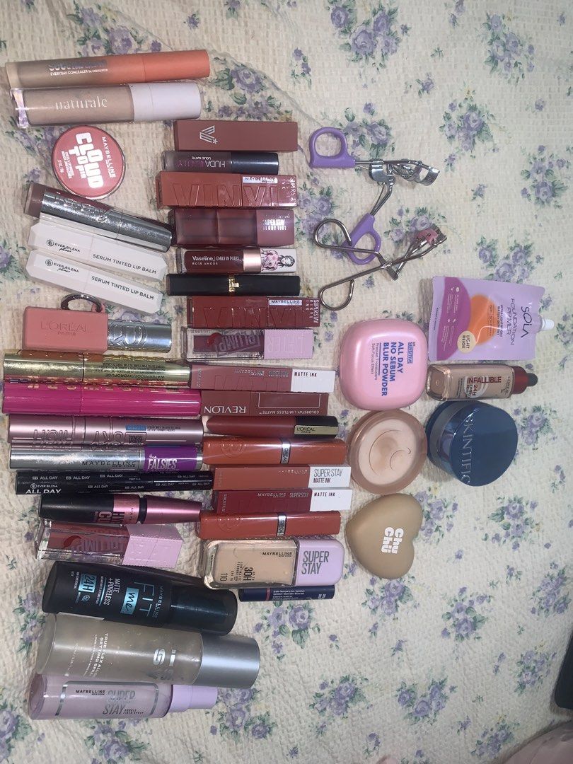 MAKEUP BUNDLE TAKE ALL 💛 (Category: Makeup) located in Makati City. Submitted by FashionFactory (Listing ID 1433957862, Image 3). Description: - Makeup bundle includes: - Lipsticks (various shades) - Mascaras - Concealers - Face Powders - Lip Balms - Eyelash Curler - Brands: Maybelline, Revlon, L'Oreal, Huda - Offers a range of products for a complete makeup look. - Condition: all items are used but in good condition:) what you see is what you g