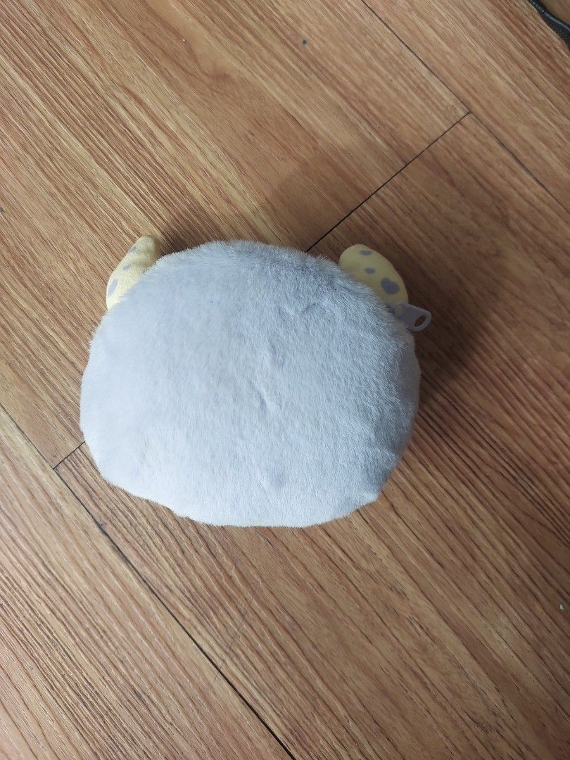 Mumuso Wallet (pre - owned) (Category: Purses & Pouches) located in Manila. Submitted by melissaga98708 (Listing ID 1433862390, Image 3). Description: - Adorable moon face plush pouch - Soft and fluffy material - Light blue body with purple eyes and pink mouth - Features two small, spotted yellow appendages - Secure zipper closure - Ideal for coins, keys, cosmetics, and other small items.