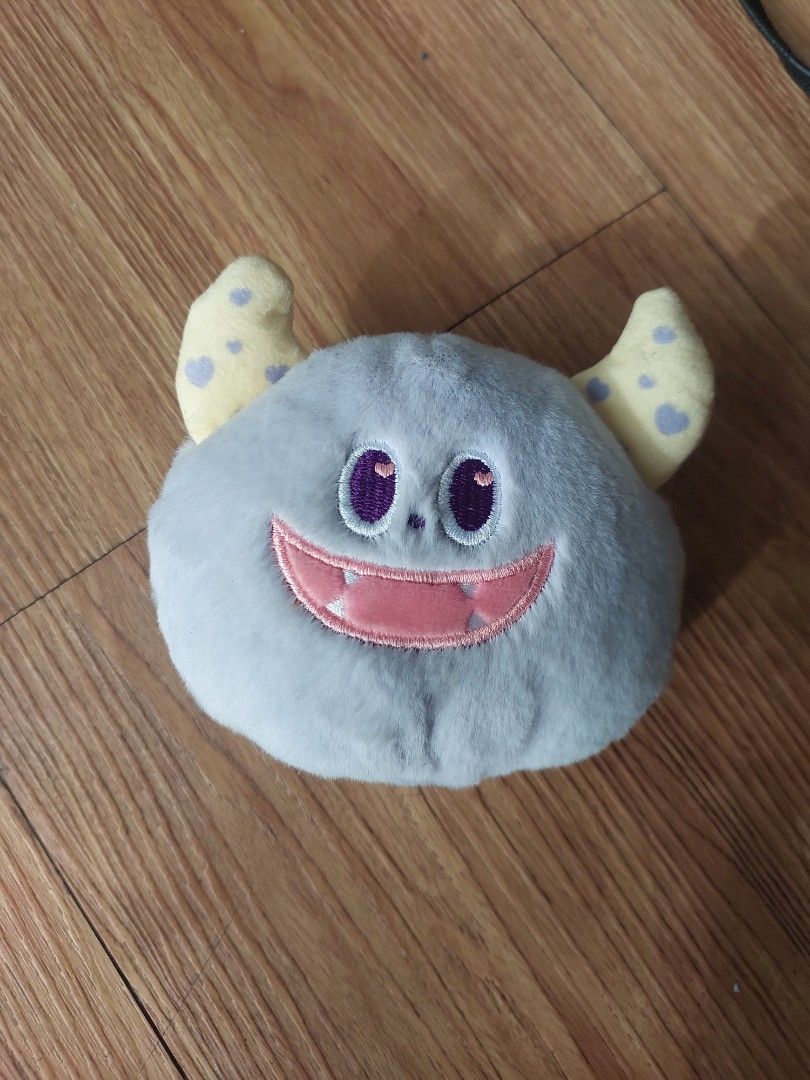 Mumuso Wallet (pre - owned) (Category: Purses & Pouches) located in Manila. Submitted by melissaga98708 (Listing ID 1433862390, Image 1). Description: - Adorable moon face plush pouch - Soft and fluffy material - Light blue body with purple eyes and pink mouth - Features two small, spotted yellow appendages - Secure zipper closure - Ideal for coins, keys, cosmetics, and other small items.