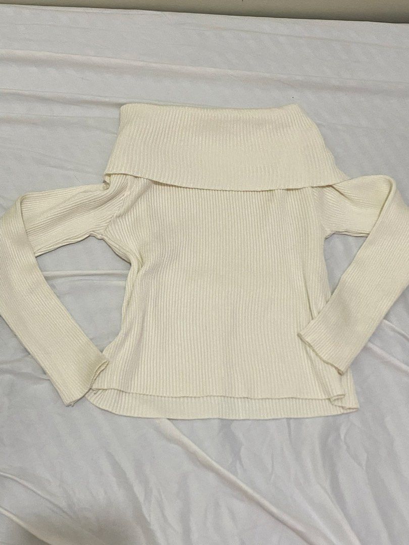 Off-Shoulder Ribbed Sweater (Category: Longsleeves) located in Manila. Submitted by cstdjyc (Listing ID 1433936780, Image 1). Description: - Cream-colored off-shoulder sweater - Ribbed knit design - Long sleeves - Wide, folded-over neckline - Slightly curved hemline - Great for layering.