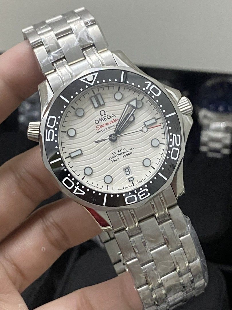 Omega Seamaster Professional Watch (Category: Luxury Watches) located in Manila. Submitted by donwatches15 (Listing ID 1433806423, Image 1). Description: - Omega Seamaster Professional watch - Stainless steel bracelet - Available in multiple dial and bezel colors - Features a distinctive wave pattern dial - Rotating bezel with timekeeping markings - Screw-down crown perfect for gift .