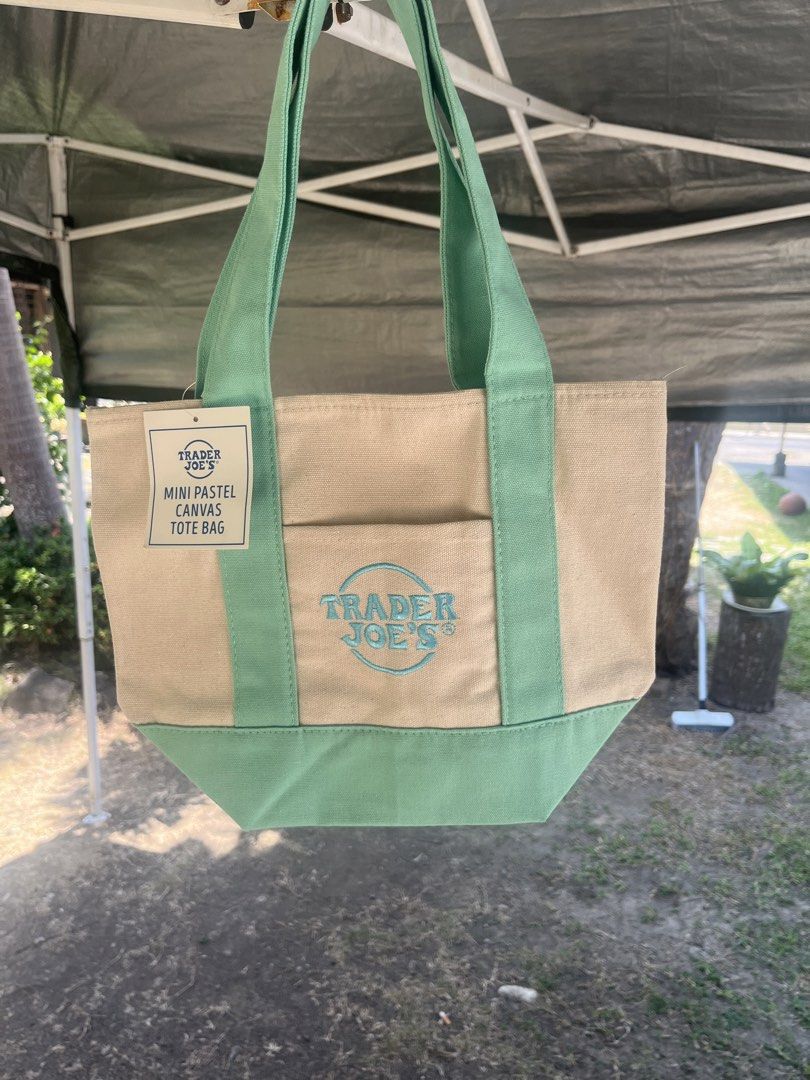 Original Trader Joe's Tote Bag (Category: Tote Bags) located in Lipa City. Submitted by coolthreadss (Listing ID 1433811502, Image 3). Description: Cute and stylish Trader Joe’s Mini Pastel Canvas Tote Bag. Made from durable canvas with a beige body and mint green handles and bottom. Perfect for daily use, quick errands, lunch bag, or small essentials. Lightweight but sturdy and very trendy. ✨ Brand: Trader Joe’s ✨ Material: Canvas ✨ Color: Beige