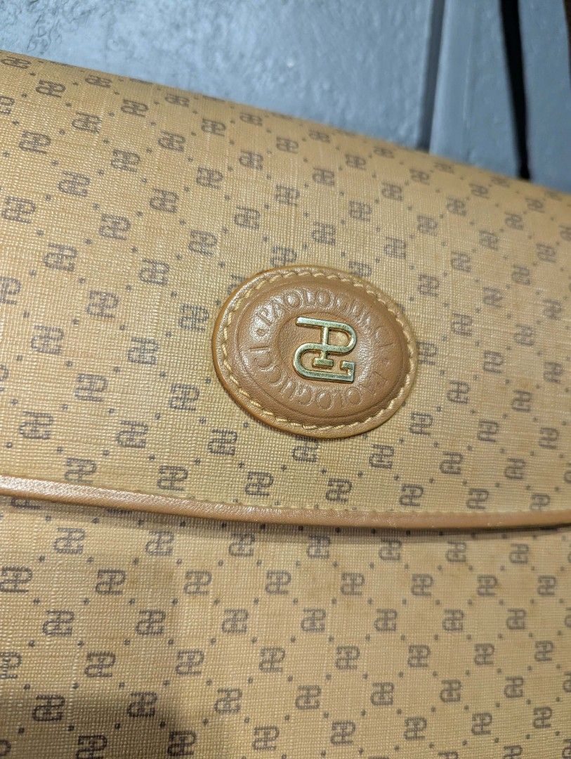 Paolo Gucci Shoulder Bag (Category: Luxury Bags & Wallets) located in Manila. Submitted by roblesniks33584 (Listing ID 1433896381, Image 3). Description: - Paolo Gucci shoulder bag - Flap closure - Adjustable long strap - Repeating Paolo Gucci logo pattern - Interior zippered pocket - Gold-toned hardware - Includes brand tag and serial number.