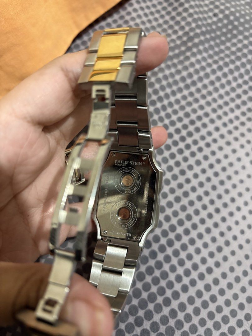 Philip Stein Dual Time Zone Men’s Watch (Category: Luxury Watches) located in Pasig City. Submitted by kaiplays (Listing ID 1433920233, Image 2). Description: - Philip Stein watch - Dual time zone display - Gold and silver-tone stainless steel band - White dial with Roman numeral hour markers - Includes subdial Location : Pasig City Send me your offers 💕.