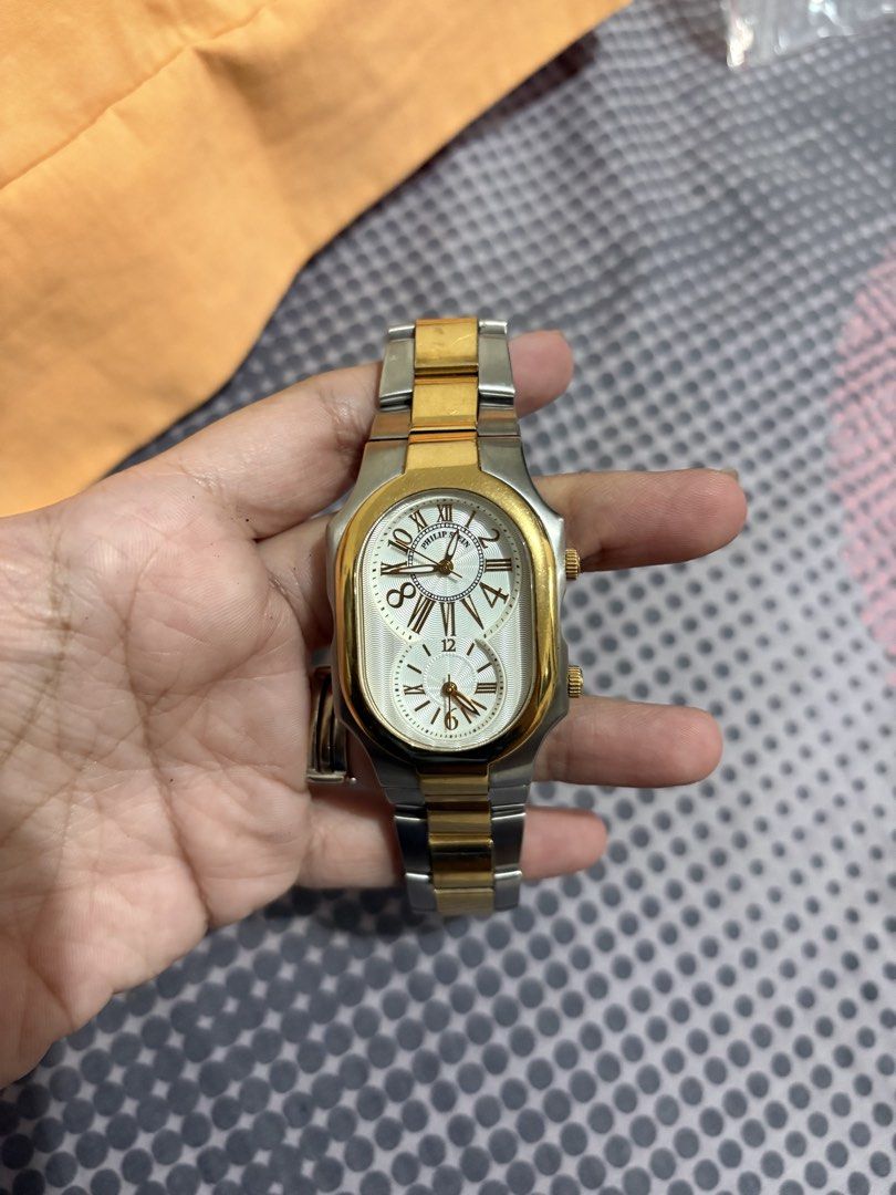 Philip Stein Dual Time Zone Men’s Watch (Category: Luxury Watches) located in Pasig City. Submitted by kaiplays (Listing ID 1433920233, Image 1). Description: - Philip Stein watch - Dual time zone display - Gold and silver-tone stainless steel band - White dial with Roman numeral hour markers - Includes subdial Location : Pasig City Send me your offers 💕.