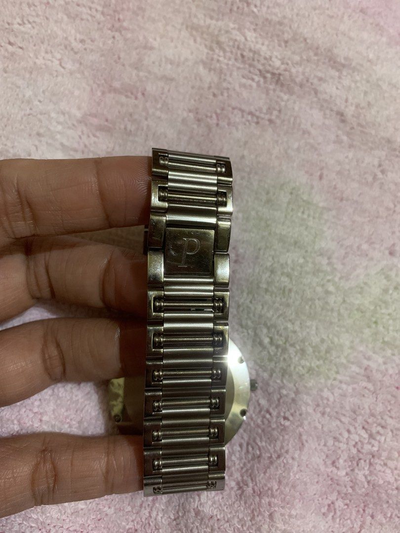 Piaget Diamond Watch (Category: Luxury Watches) located in Quezon City. Submitted by ncjnc (Listing ID 1433906396, Image 3). Description: - Piaget watch - Mother-of-pearl dial - Diamond accents - Stainless steel band and case - Classic round face design - Secure clasp - Piaget logo engraved on the back - Perfect for any occasion.