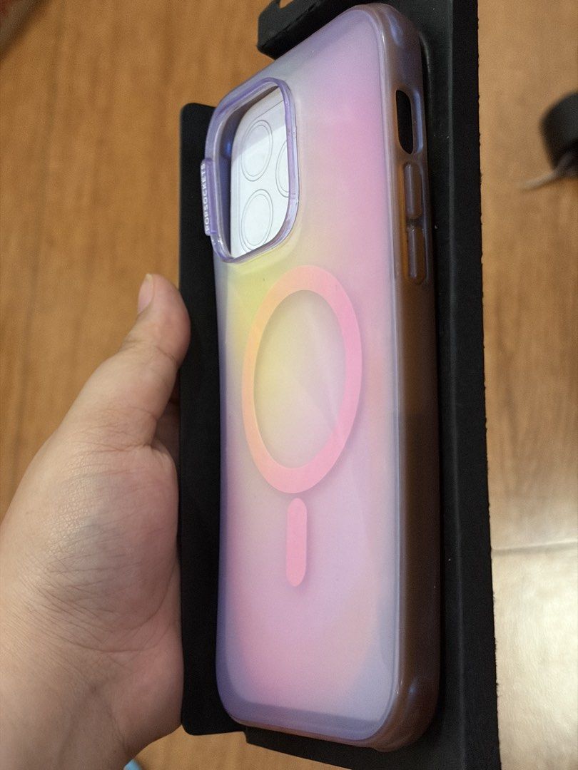 Popsocket case aura (Category: Cases & Sleeves) located in Quezon City. Submitted by stuffyy (Listing ID 1433788970, Image 3). Description: - Popsocket Aura Case - Designed for iPhone 14 Pro Max - Features an iridescent color - Made with plant-based materials - MagSafe compatible This is well used hence the price. The back part is very makinis.