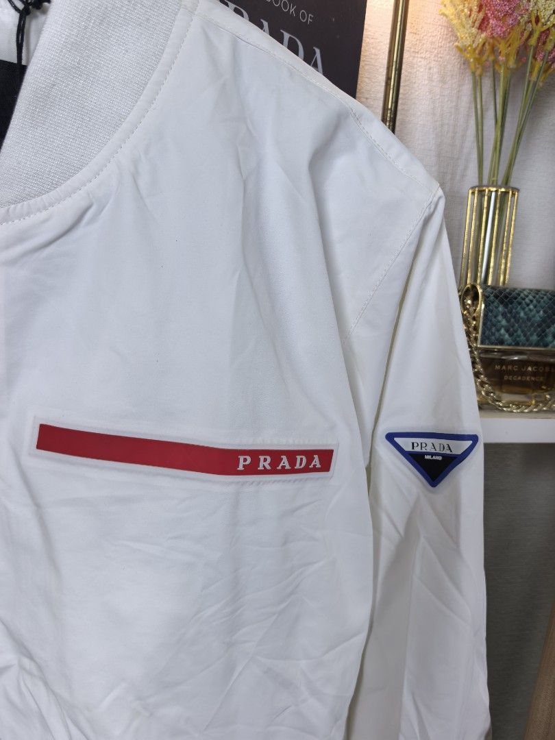 Prada bomber jacket (Category: Luxury Apparel) located in Baguio. Submitted by ashzachary (Listing ID 1433930961, Image 3). Description: Prada bomber jacket Condition :Excellent condition Color rate 10/10 Size : Medium Inches:W22/L26 No issues No flaws Super ganda sa personal Pm. More details Good quality Plsss 📌No Bogus 📌No return MOP What you see is what you get PALAWAN, CEBUNA GCASH AND BDO Reminder😊 We're selling thrifted clothes so please