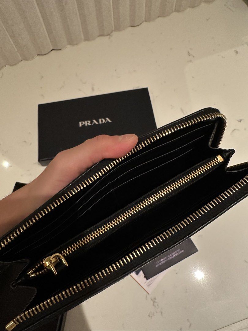 Prada Quilted Tessuto Wallet (Category: Luxury Bags & Wallets) located in Quezon City. Submitted by cailincare94698 (Listing ID 1433836848, Image 3). Description: - Like New - With Authentication Card - Zip Around Wallet - Quilted Black .