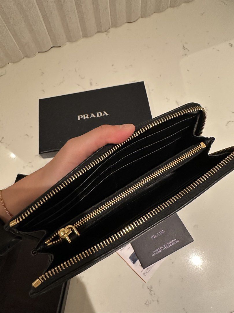 Prada Quilted Tessuto Wallet (Category: Luxury Bags & Wallets) located in Quezon City. Submitted by cailincare94698 (Listing ID 1433836848, Image 2). Description: - Like New - With Authentication Card - Zip Around Wallet - Quilted Black .