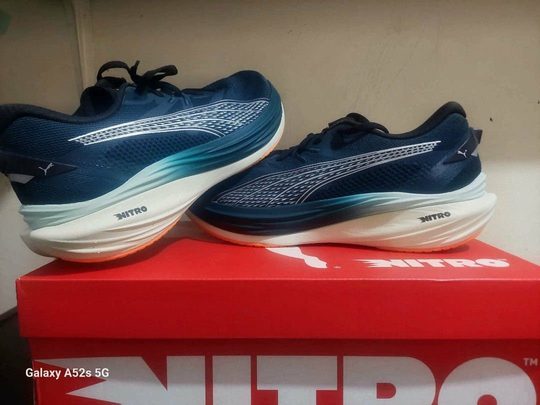 Puma Deviate Nitro Running Shoes (Category: Sneakers) located in Batac City. Submitted by cletzdeclutter (Listing ID 1433918940, Image 2). Description: - Puma Deviate Nitro running shoes - Yellow Alert- PUMA Black is Size US 10.5 (28.5cm) - Green Terrain- Heat Fire is Size US 11 (29 cm) SOLD - Features Nitro foam technology for enhanced cushioning and responsiveness - Comes with original box - Perfect for running and athletic activities.