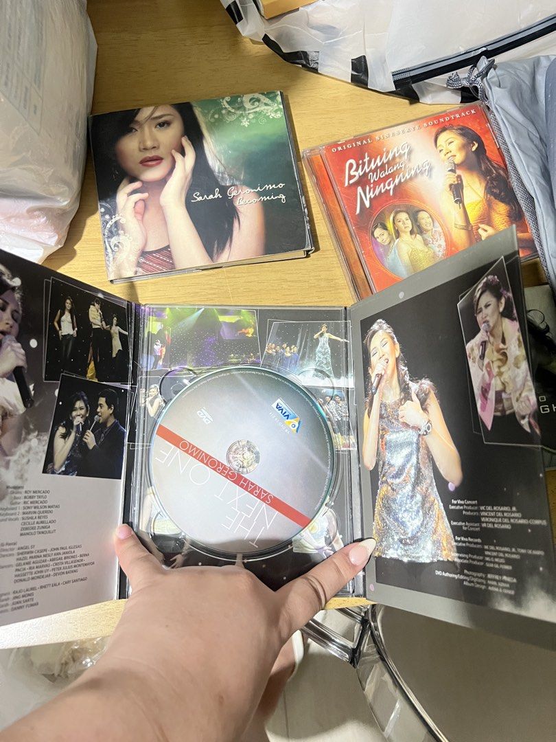 Sarah Geronimo CD and DVD Bundle (Category: CDs & DVDs) located in Pasig City. Submitted by declutterwithai (Listing ID 1433919335, Image 2). Description: - Sarah Geronimo CD and DVD bundle - Albums included: "Sarah Geronimo", "Taking Flight", "Bituing Walang Ningning Original Soundtrack" - DVD: "The Next One" featuring Sarah Geronimo and John Lloyd Cruz - All items in original cases -One album missing CD .