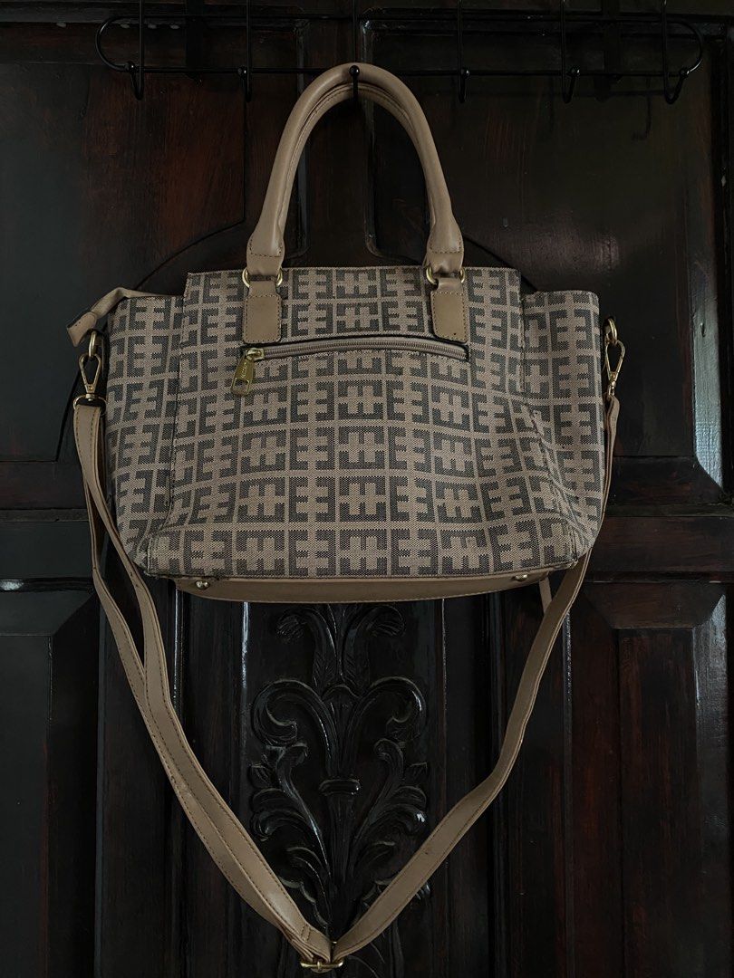 Secosana Brown Handbag with Shoulder Strap Two way Sling (Category: Shoulder Bags) located in Iloilo. Submitted by cbd222 (Listing ID 1433813019, Image 2). Description: - Tan and brown geometric patterned handbag - Includes two handles and a detachable shoulder strap - Features side zippers and a top zipper.