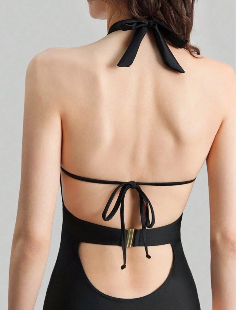 Shein Black Halter Neck Swimsuit (Category: Bikinis & Swimsuits) located in Manila. Submitted by decluterrracct (Listing ID 1433971740, Image 2). Description: Black Backless Halter One-Piece Swimsuit Size: M Condition: Preloved (worn once, like new) Minimalist yet super flattering ✨ This sleek black one-piece features a backless cut with adjustable halter and back ties for a secure, customizable fit. Perfect for beach days, poolside lounging, or 