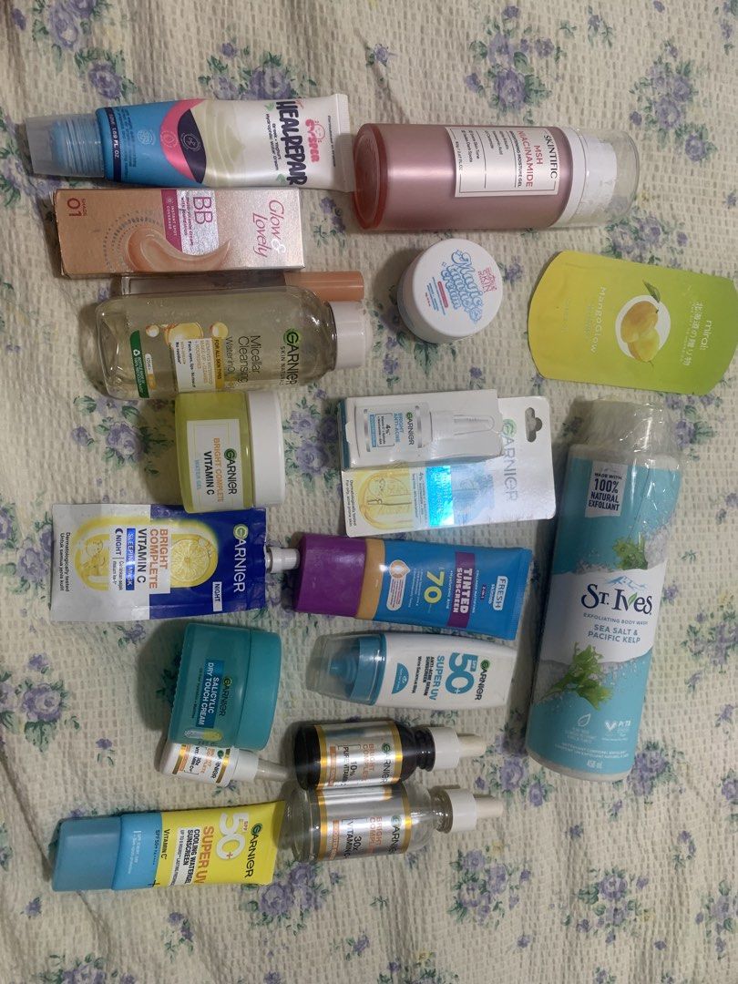 SKINCARE BUNDLE TAKE ALL 🩷🩷 (Category: Face Care) located in Makati City. Submitted by FashionFactory (Listing ID 1433960045, Image 3). Description: Assorted skincare products including Garnier Vitamin C serum, sunscreen, and face wash. Also includes St. Ives body wash, MIRAI body scrub, and other items. Some products are in tubes, bottles, and jars. The items are various sizes and for different skincare needs. Condition: some items are slightl