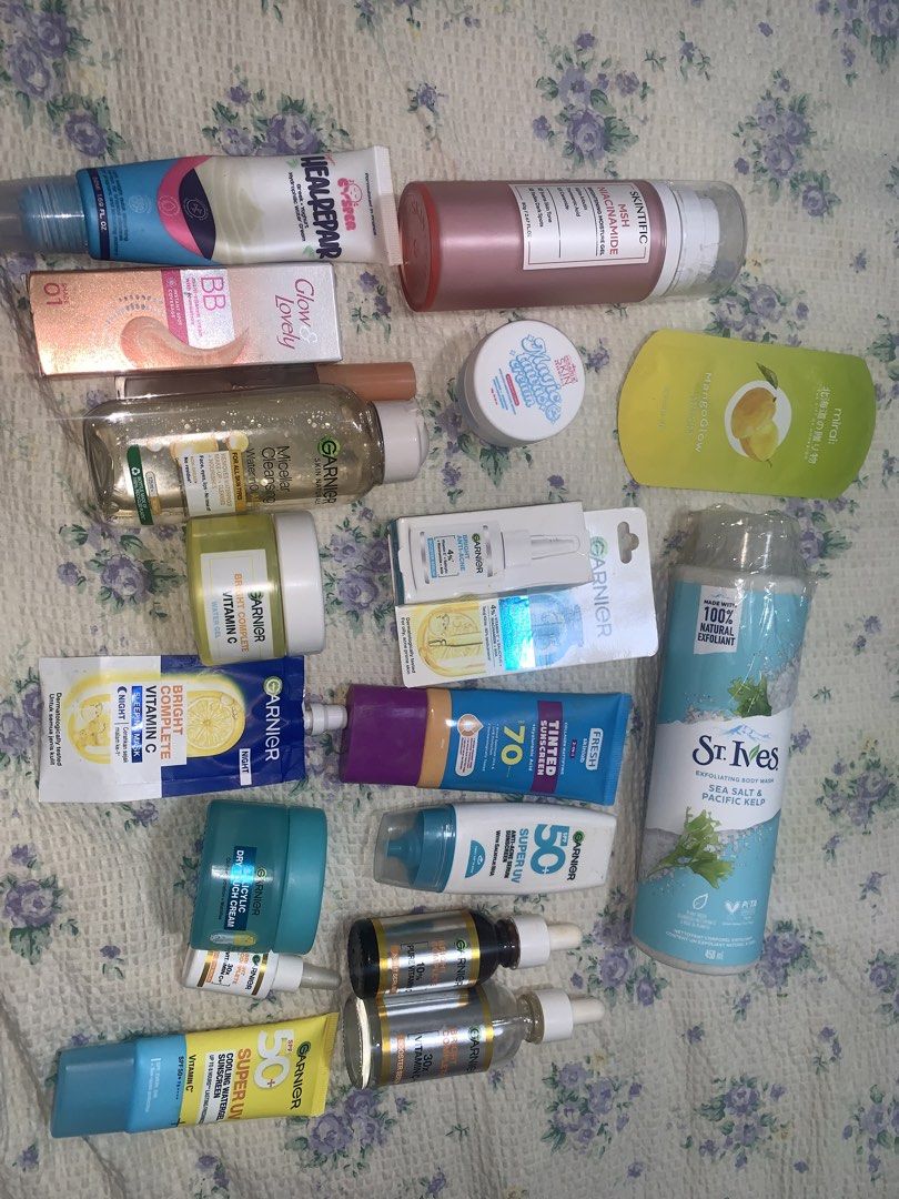 SKINCARE BUNDLE TAKE ALL 🩷🩷 (Category: Face Care) located in Makati City. Submitted by FashionFactory (Listing ID 1433960045, Image 2). Description: Assorted skincare products including Garnier Vitamin C serum, sunscreen, and face wash. Also includes St. Ives body wash, MIRAI body scrub, and other items. Some products are in tubes, bottles, and jars. The items are various sizes and for different skincare needs. Condition: some items are slightl