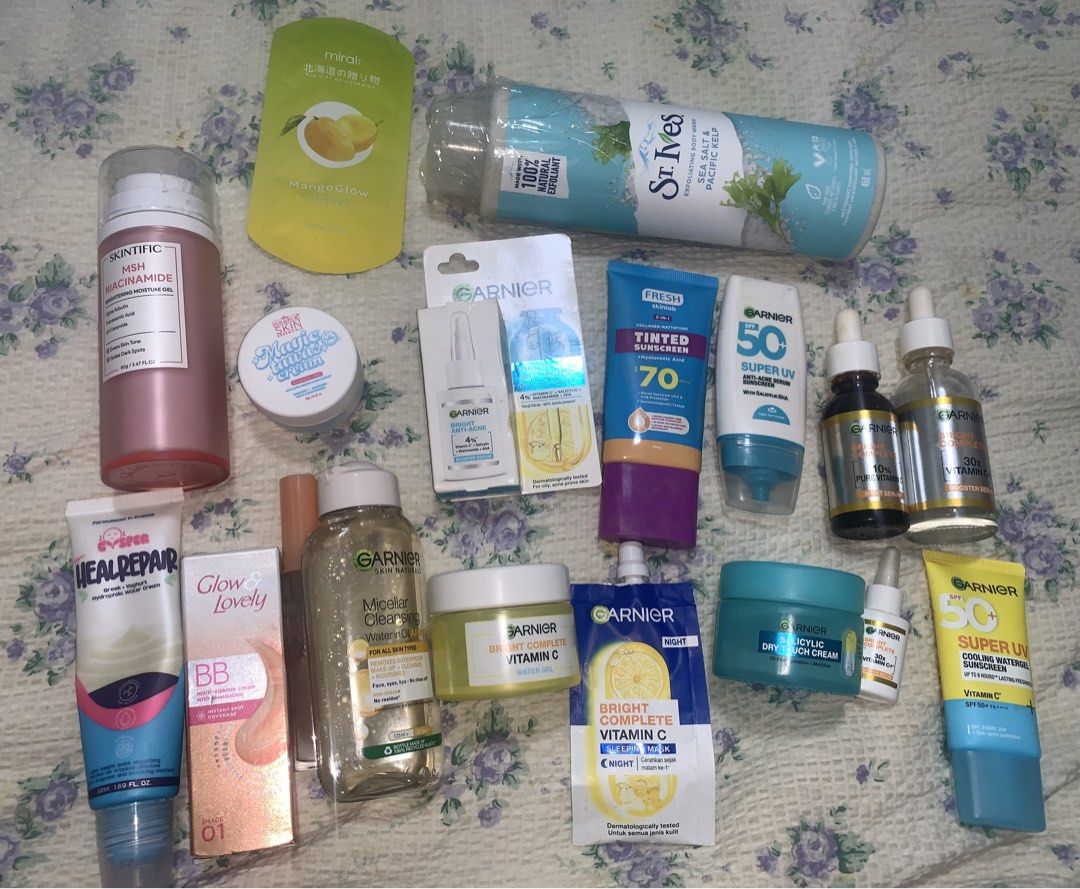 SKINCARE BUNDLE TAKE ALL 🩷🩷 (Category: Face Care) located in Makati City. Submitted by FashionFactory (Listing ID 1433960045, Image 1). Description: Assorted skincare products including Garnier Vitamin C serum, sunscreen, and face wash. Also includes St. Ives body wash, MIRAI body scrub, and other items. Some products are in tubes, bottles, and jars. The items are various sizes and for different skincare needs. Condition: some items are slightl
