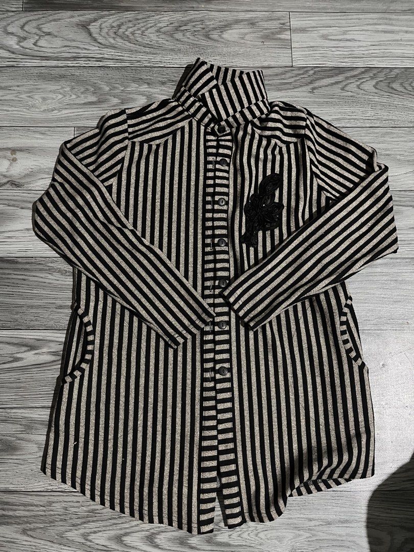 Striped Long Sleeve Shirt (Category: Tshirts & Polo Shirts ) located in Pasig City. Submitted by anya2000 (Listing ID 1433898118, Image 1). Description: - Long sleeve shirt - Vertical black and beige stripes - High collar - Button-down front - Two pockets - Decorative black applique on chest - Textured fabric -xl tag but can fit to medium ppl.