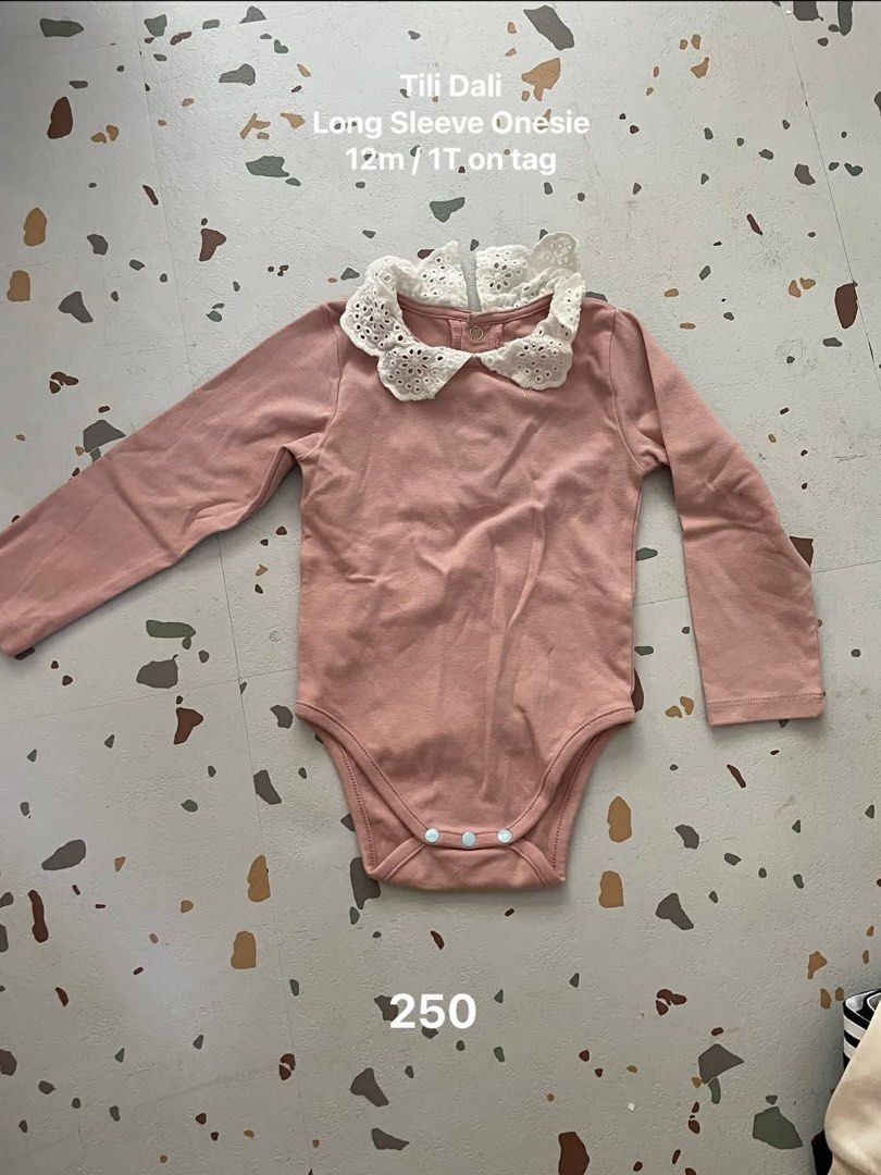 Tili Dali Long Sleeve Onesie (Category: Babies & Kids Fashion) located in Mandaluyong City. Submitted by randomrom (Listing ID 1433817439, Image 1). Description: - Tili Dali long sleeve onesie - Size: 12m/1T - Color: Pink body with white lace collar - Features snap closures at the bottom - Price: PHP 250.