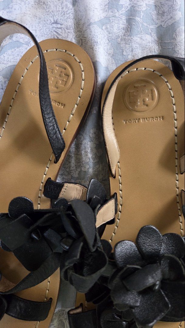 Tory Burch Black Leather Blossom Gladiator Sandals (Category: Flats & Sandals) located in Muntinlupa City. Submitted by sungbora90 (Listing ID 1433852464, Image 3). Description: - Tory Burch sandals - Black leather straps - Floral embellishments - Flat sole - Ankle strap - Light brown footbed with Tory Burch logo - Dark brown textured sole - Size L.