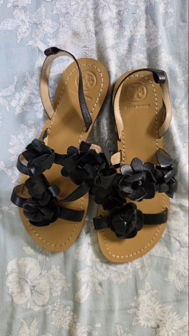 Tory Burch Black Leather Blossom Gladiator Sandals (Category: Flats & Sandals) located in Muntinlupa City. Submitted by sungbora90 (Listing ID 1433852464, Image 2). Description: - Tory Burch sandals - Black leather straps - Floral embellishments - Flat sole - Ankle strap - Light brown footbed with Tory Burch logo - Dark brown textured sole - Size L.