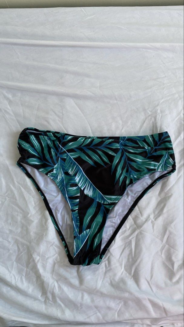 Tropical Print Swimsuit Bottom (Category: Bikinis & Swimsuits) located in Manila. Submitted by cstdjyc (Listing ID 1433937197, Image 1). Description: - High-waisted swimsuit bottom - Tropical leaf print (green & blue on black) - Classic cut - Smooth swimwear material - White lining.