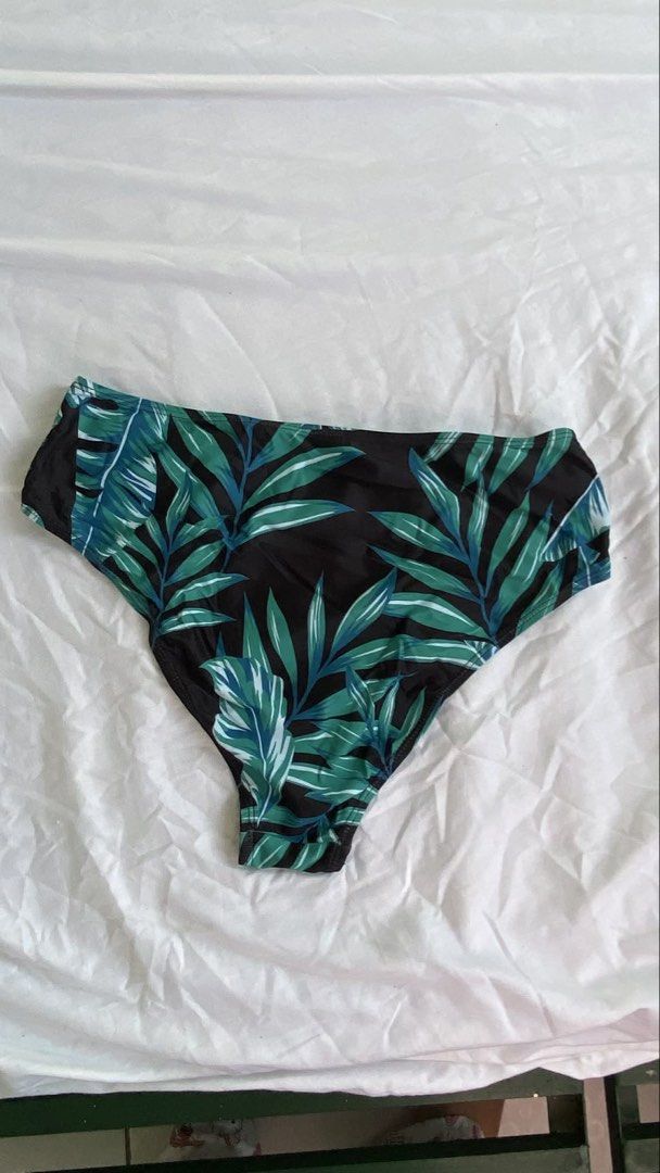 Tropical Print Swimsuit Bottom (Category: Bikinis & Swimsuits) located in Manila. Submitted by cstdjyc (Listing ID 1433937197, Image 2). Description: - High-waisted swimsuit bottom - Tropical leaf print (green & blue on black) - Classic cut - Smooth swimwear material - White lining.