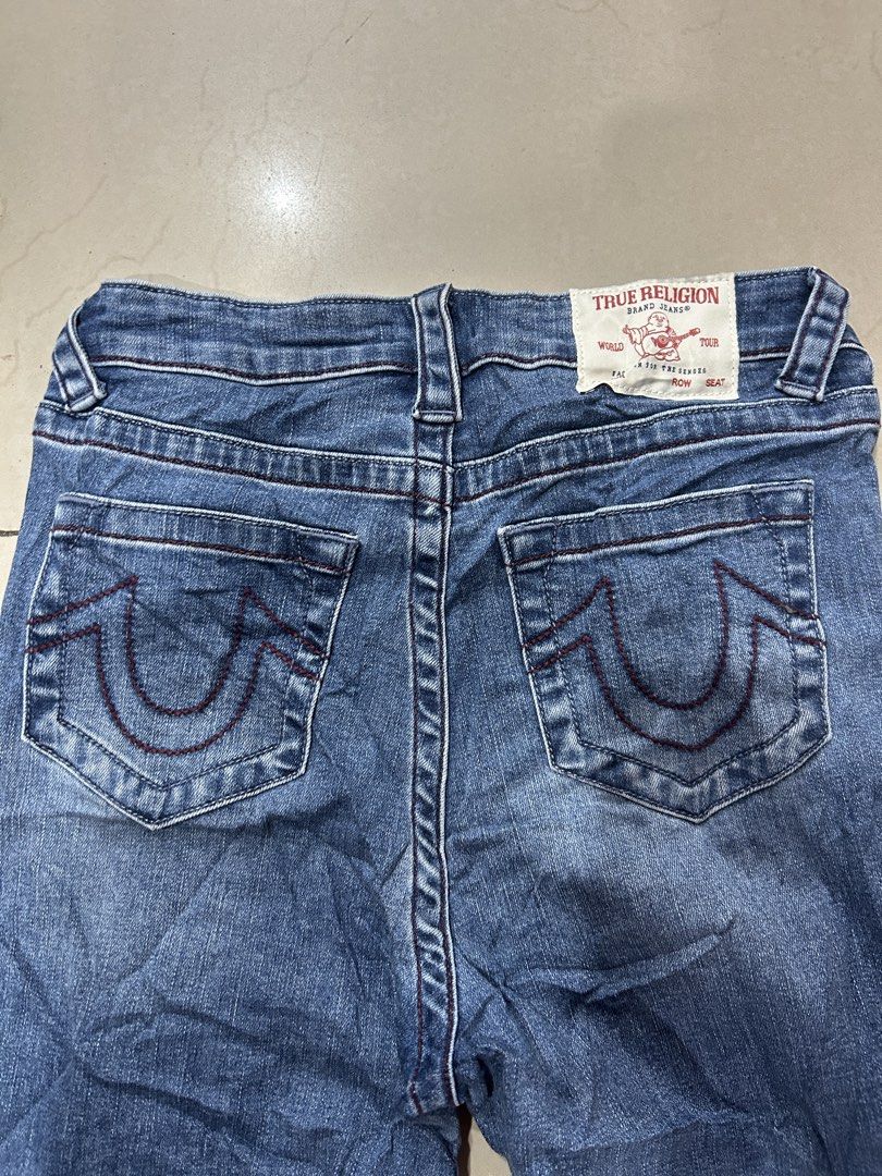 True Religion Jeans (Category: Jeans) located in Tagbilaran City. Submitted by montonanth93783 (Listing ID 1433788001, Image 2). Description: - Authentic True Religion jeans - Classic blue wash - Bootcut style - Visible size tag - Button and zipper closure - Signature horseshoe stitching on back pockets - True Religion logo visible.