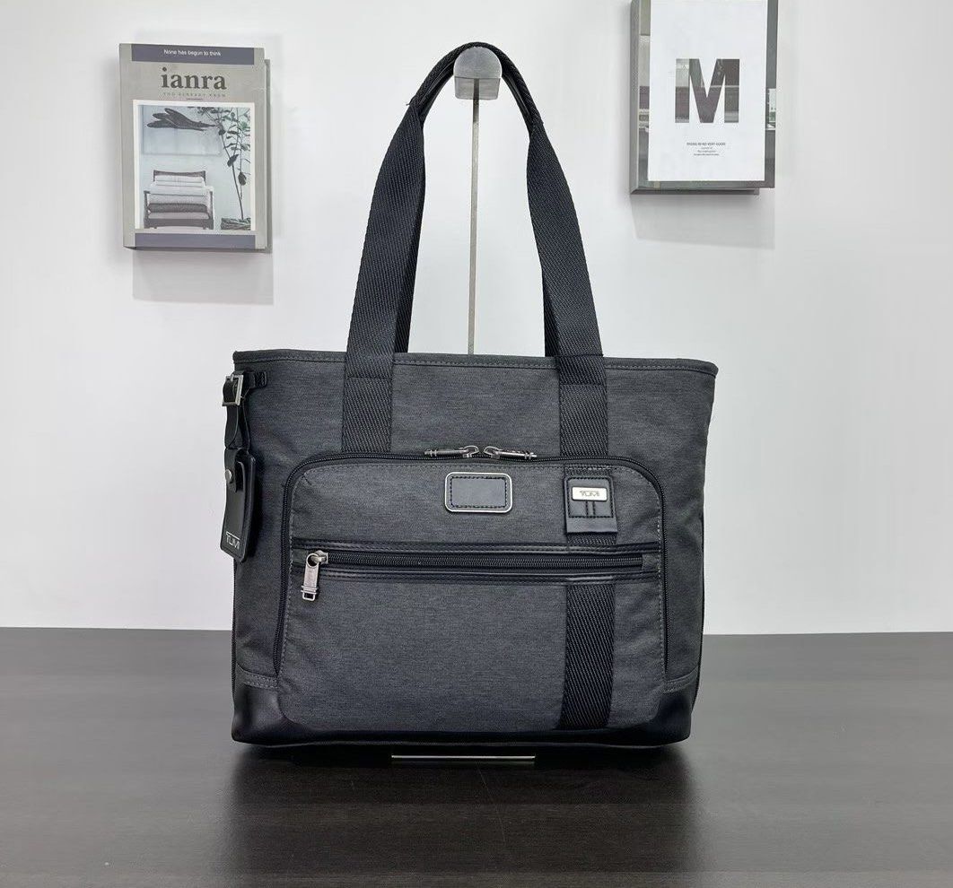 Tumi East West Tote Bag (Category: Tote Bags) located in Manila. Submitted by bagmaniaph (Listing ID 1433943374, Image 1). Description: A spacious tote crafted from durable polyester makes the perfect travel companion for your next weekend getaway. A smart Add-a-Bag strap means you can easily attach it to the handle of a rolling suitcase for added convenience..