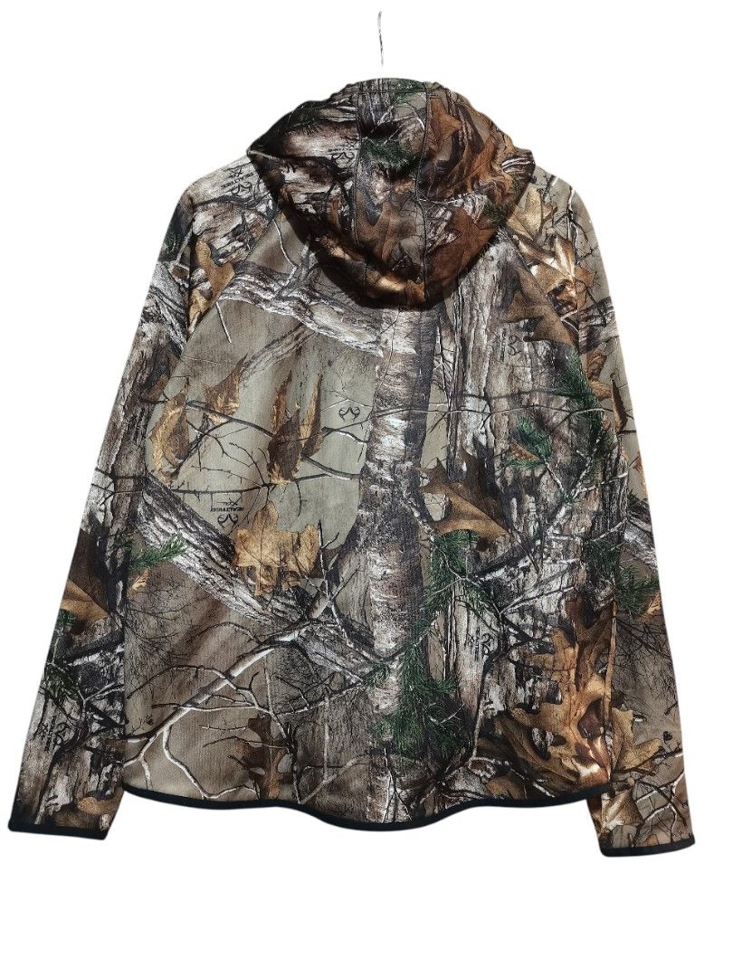 Under Armour Camo Hoodie (Category: Coats, Jackets and Outerwear) located in Manila. Submitted by eagerbeaverph (Listing ID 1433975527, Image 2). Description: - Under Armour camo hoodie - Size: XL/TG/GG/BARDOW/LL - Features a front pocket - Under Armour logo on chest - Drawstring hood - Storm technology - Style number: 1286051 Underarmour real tree camo hoodie Xl L 27 inches W 24 Good condition Minimal signs of usage .