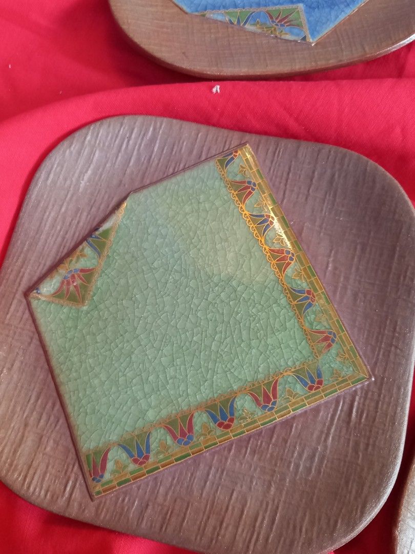 Vintage Ceramic Coasters Set of 5 (Category: Other Kitchenware & Tableware) located in Tuguegarao City. Submitted by zenphoenix-7ad615 (Listing ID 1433879645, Image 3). Description: - Set of 5 vintage ceramic coasters - Square tiles with decorative borders - Each coaster features a unique color - Set on a wooden-like base - Glazed underside with stamp - Ideal for home decor.