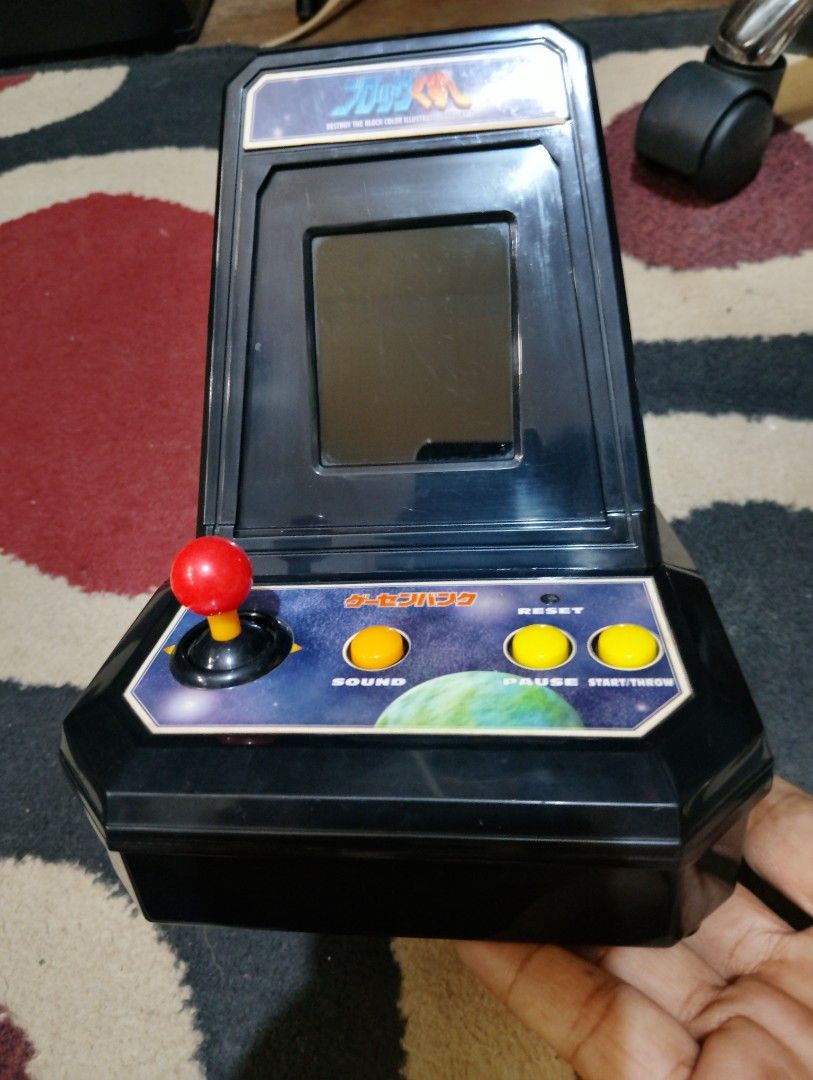 vintage tabletop arcade game (Category: Others) located in Manila. Submitted by boyhet.thrift15 (Listing ID 1433865894, Image 2). Description: - Vintage Tomy LSI Game Lupin handheld game - Includes original box - Comes with AC adapter - Features black and silver design - Box shows some wear - gud condition - Arkanoid arcade coin bank (used item/mejo mahirap ma move ung left/right analog nid hard push ) - both item nid 4pcs type C batt. selling bu