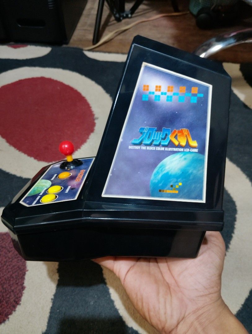 vintage tabletop arcade game (Category: Others) located in Manila. Submitted by boyhet.thrift15 (Listing ID 1433865894, Image 3). Description: - Vintage Tomy LSI Game Lupin handheld game - Includes original box - Comes with AC adapter - Features black and silver design - Box shows some wear - gud condition - Arkanoid arcade coin bank (used item/mejo mahirap ma move ung left/right analog nid hard push ) - both item nid 4pcs type C batt. selling bu
