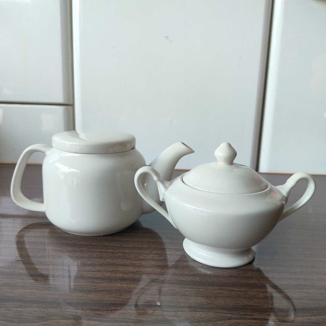 White Ceramic Teapot and Sugar Bowl Set (Category: Coffee & Tea Tableware) located in Baao. Submitted by all.things.japan (Listing ID 1433811166, Image 1). Description: WHITE TEAPOT & SUGAR POT SET In pristine condition Glossy finish Japan Surplus Dimensions: (handle excluded) Teapot: 3.75 inches (h) x 4.5 inches width Sugar pot: 4.25 inches (h) x 4.25 inches width Teapot: P350.00 Sugar pot P220.00 Take both: P 550.00 Add Sf MOP: GCash/ Landbank/