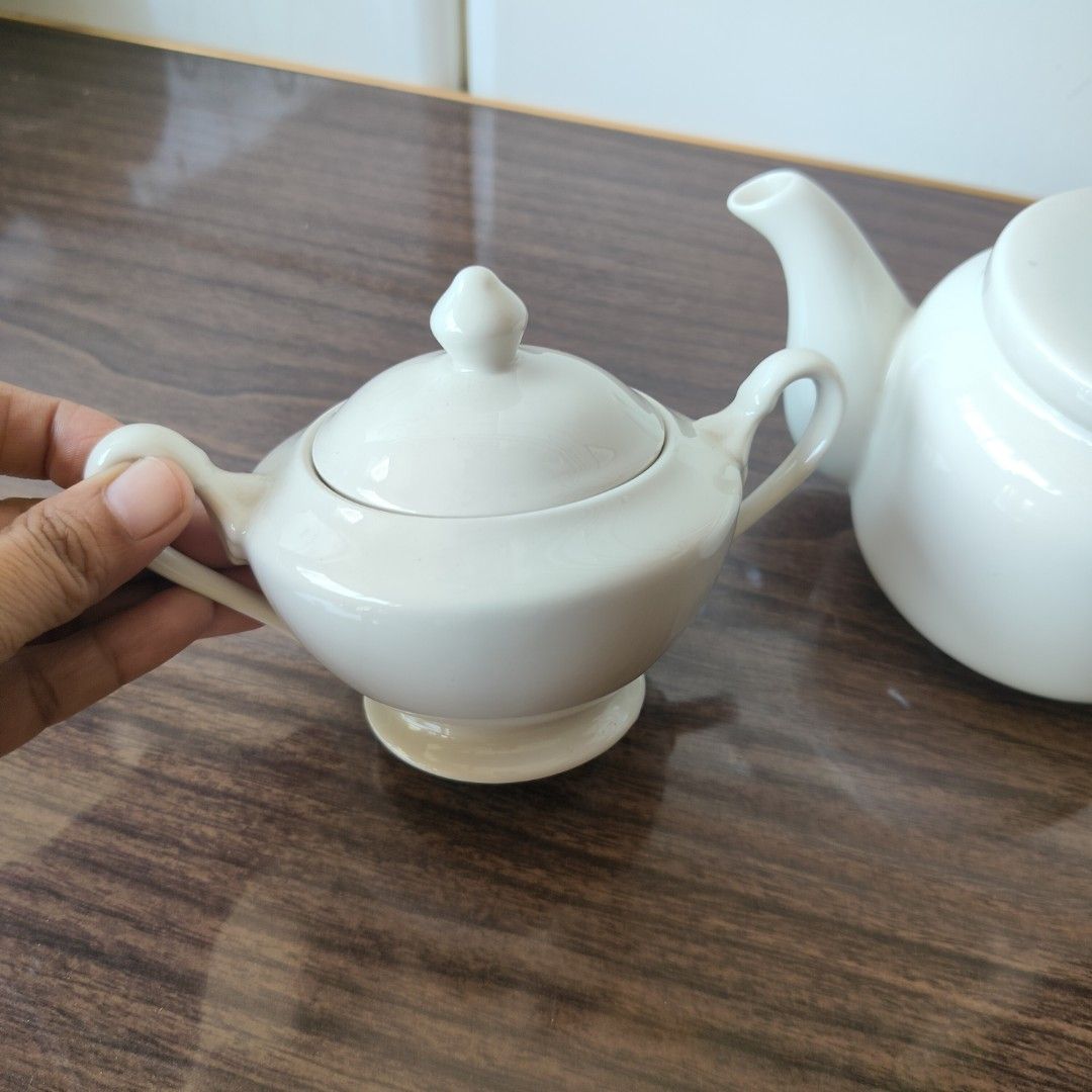 White Ceramic Teapot and Sugar Bowl Set (Category: Coffee & Tea Tableware) located in Baao. Submitted by all.things.japan (Listing ID 1433811166, Image 3). Description: WHITE TEAPOT & SUGAR POT SET In pristine condition Glossy finish Japan Surplus Dimensions: (handle excluded) Teapot: 3.75 inches (h) x 4.5 inches width Sugar pot: 4.25 inches (h) x 4.25 inches width Teapot: P350.00 Sugar pot P220.00 Take both: P 550.00 Add Sf MOP: GCash/ Landbank/