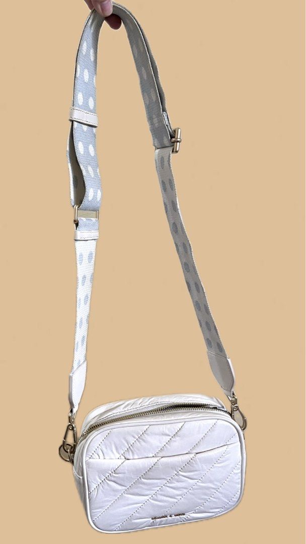 White Quilted Crossbody Bag with Polka Dot Strap (Category: Cross-body Bags) located in Quezon City. Submitted by byandi (Listing ID 1433808332, Image 3). Description: - White quilted design (puff) - Zip closure - Detachable polka dot strap - Gold hardware - Rectangular shape - Adjustable strap - Compact and stylish - Still have paperbag and dustbag :).