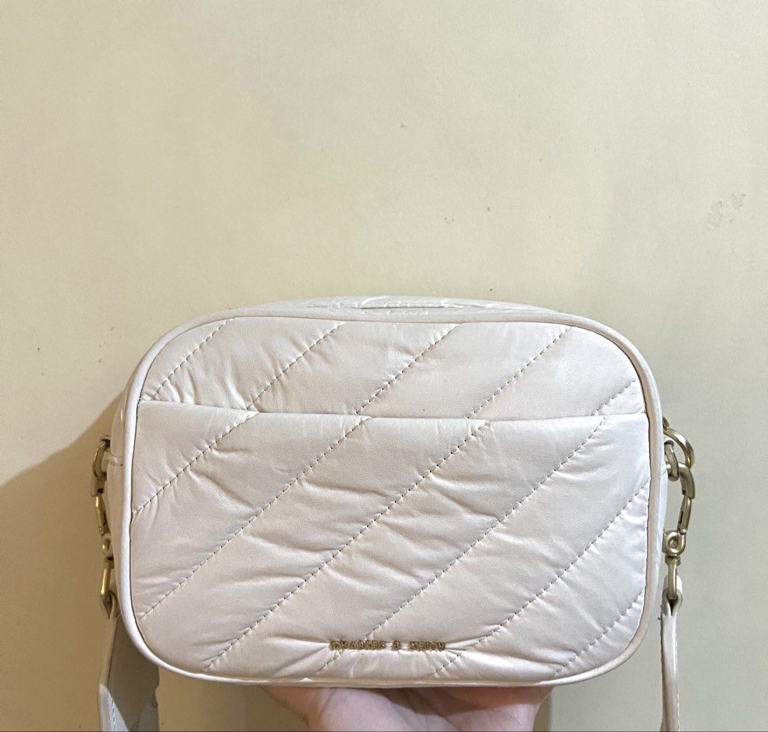 White Quilted Crossbody Bag with Polka Dot Strap (Category: Cross-body Bags) located in Quezon City. Submitted by byandi (Listing ID 1433808332, Image 1). Description: - White quilted design (puff) - Zip closure - Detachable polka dot strap - Gold hardware - Rectangular shape - Adjustable strap - Compact and stylish - Still have paperbag and dustbag :).
