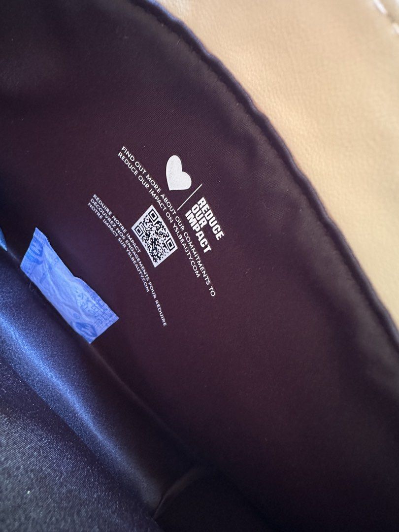 YSL Beauté Cosmetic Pouch (Category: Luxury Bags & Wallets) located in Digos. Submitted by venusacaro13427 (Listing ID 1433794767, Image 2). Description: - Authentic YSL Beauté cosmetic pouch. - Stylish beige exterior. - Secure snap closure. - Features the iconic YSL logo. - Black interior with a printed message. - Perfect for makeup and small items..