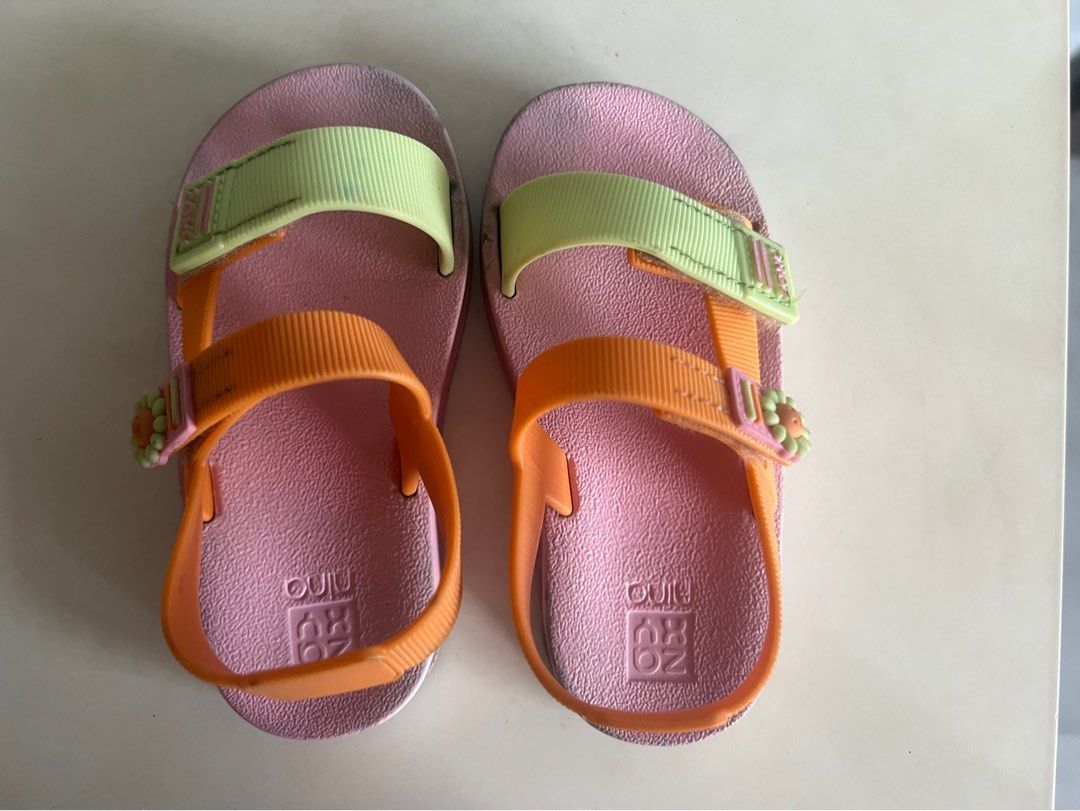 Zaxy Nina Sandals - Size 23/24 (Category: Babies & Kids Fashion) located in Marikina City. Submitted by prelovedreeses (Listing ID 1433864953, Image 1). Description: - Zaxy Nina sandals - Size: 23/24 BRA / 10 USA - Color: Pink base with orange and green straps - Features a flower detail - Condition: Some wear on soles - Ideal for your little one's summer activities.