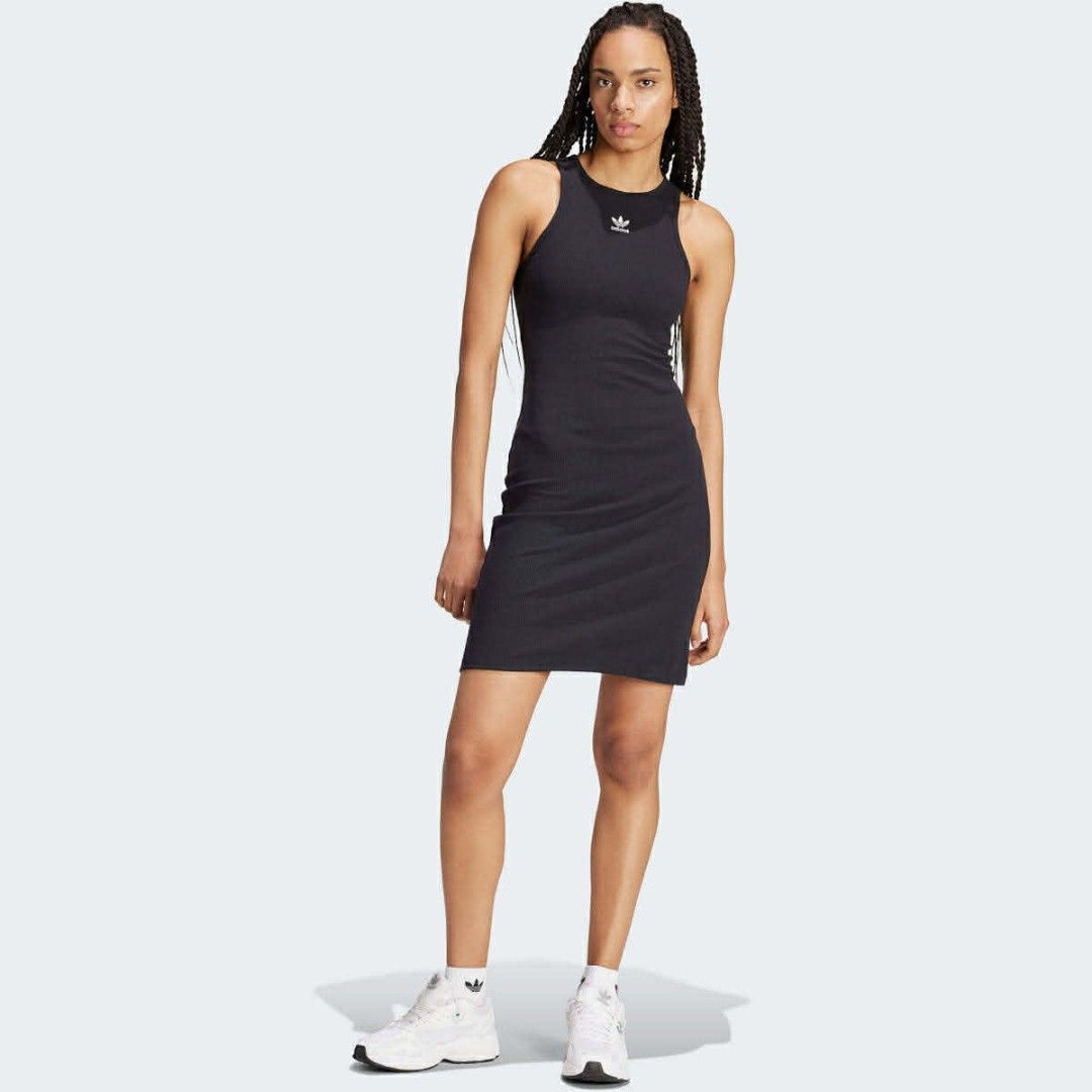 Adidas Adicolor Essentials Rib Tank Dress (Category: Dresses) located in Manaoag. Submitted by love.abgl (Listing ID 1434101121, Image 1). Description: - Adidas tank dress in black - Features the Adidas trefoil logo - Sleeveless design - Bodycon fit - Size: UK 14, J COM 38, F 42 - Made in Vietnam - Soft, stretchy material.